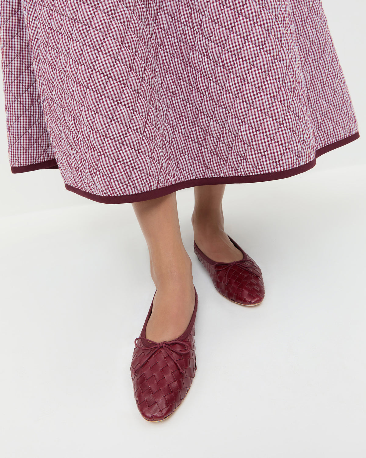 Landry Wine Woven Ballet Flat in red wine woven leather and Clara Quilted Skirt in maroon gingham.