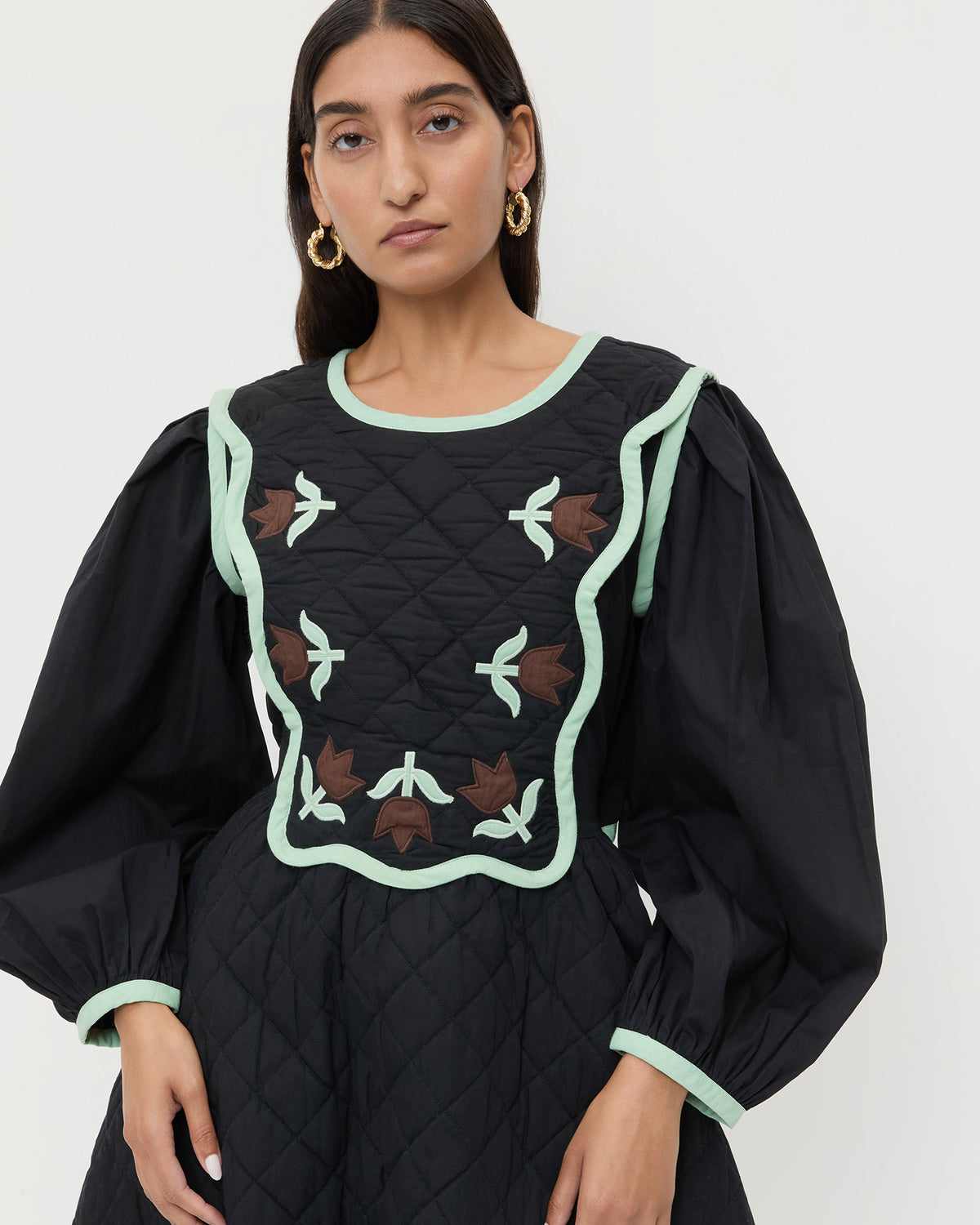 Laney Short Dress in quilted black cotton with mint and brown floral design.