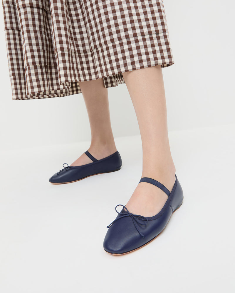 Leonie Navy Leather Ballet Flat in navy blue leather and Diane Dress in brown and cream gingham.