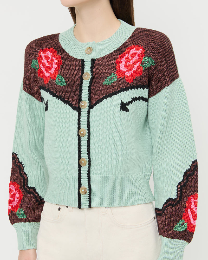 Linda Intarsia Cardigan in green and red wool and Winona Denim Barrel Pant in natural.