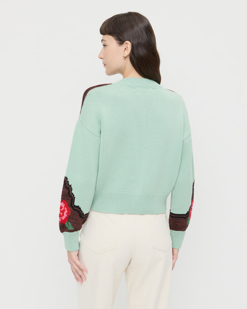 Linda Intarsia Cardigan in green and red wool and Winona Denim Barrel Pant in natural.