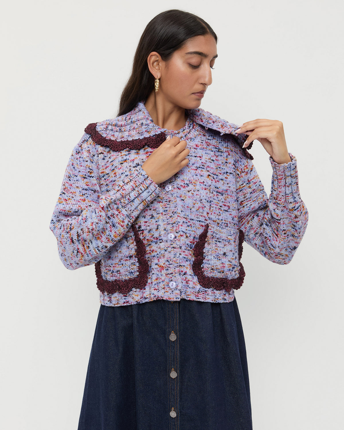 Lo Cardigan in marble maroon wool and Ruthie Denim Skirt in dark blue.