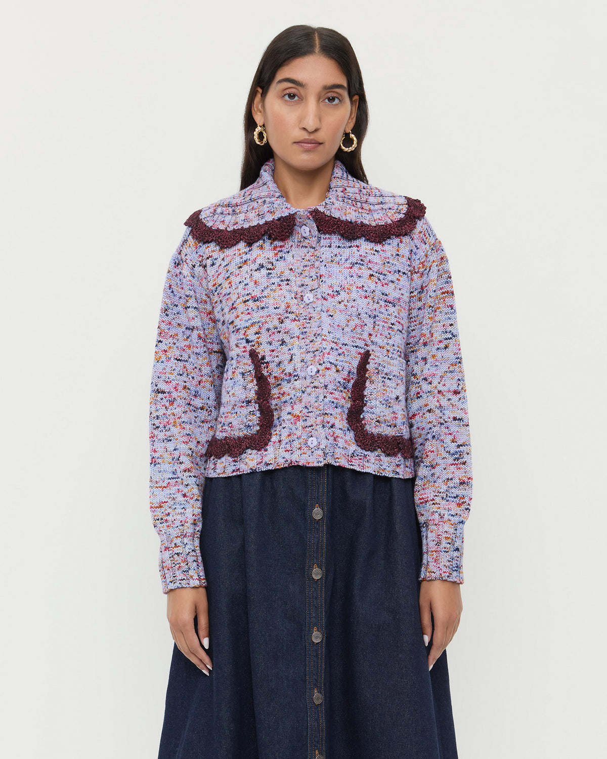 Lo Cardigan in marble maroon wool and Ruthie Denim Skirt in dark blue.
