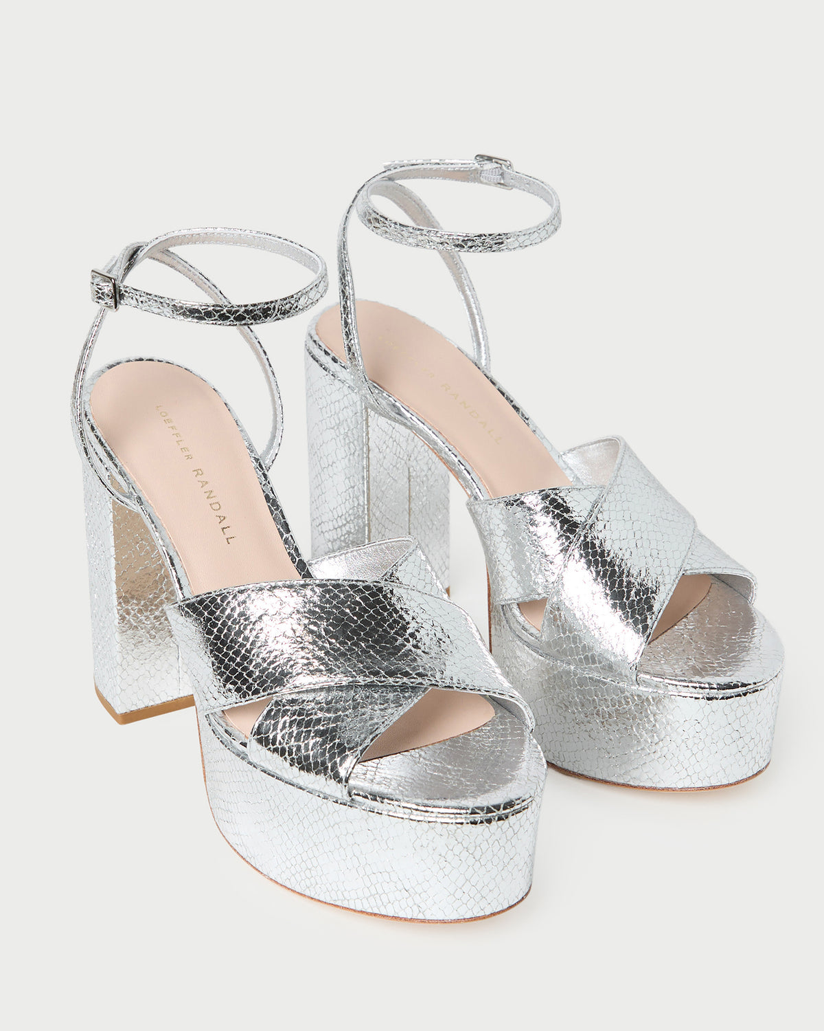 Loretta Silver Snake Platform Sandal in silver snake embossed leather.