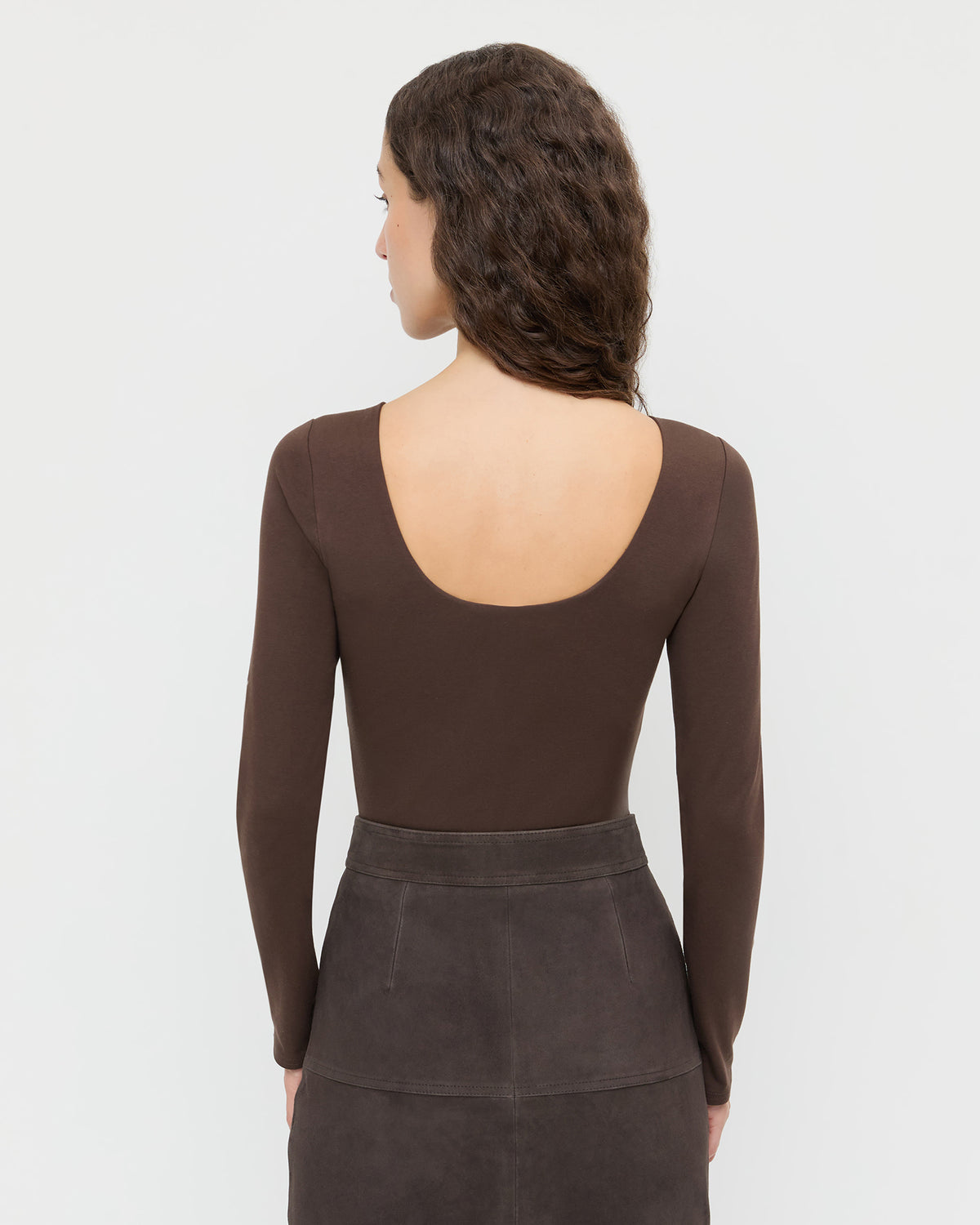Lumi Long-Sleeve Bodysuit in chocolate brown jersey fabric and Tansy Suede Skirt in brown suede.