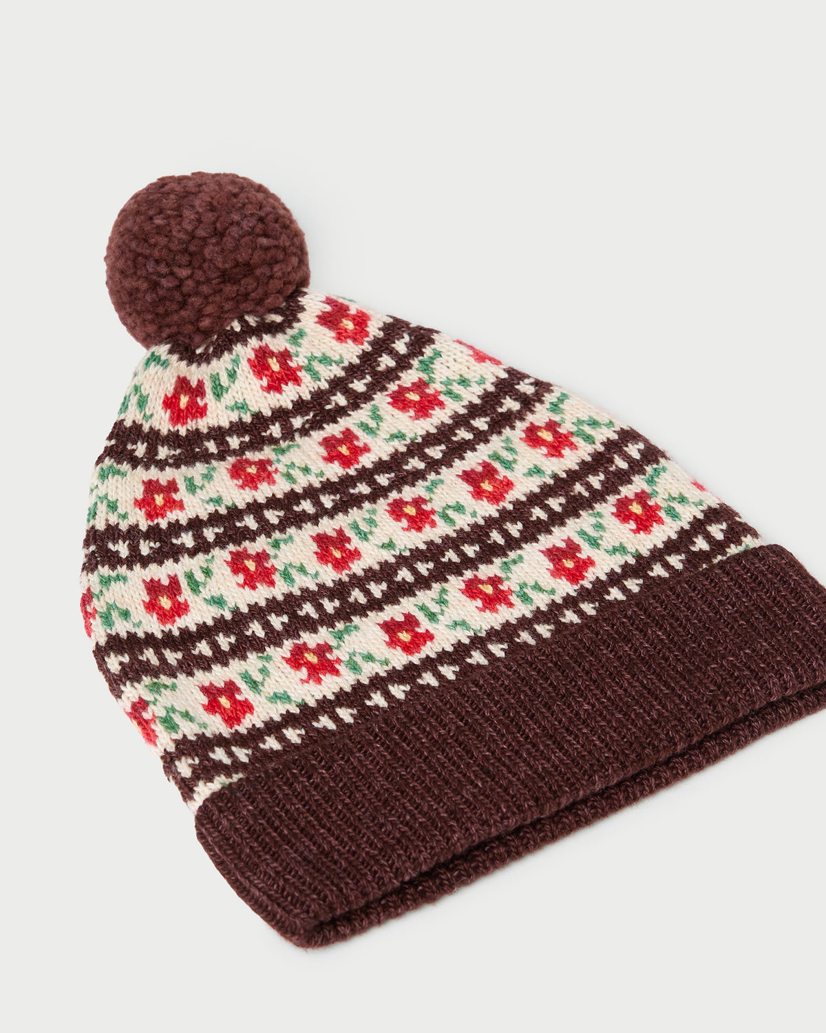 Macelyn Brown Floral Intarsia Hat in brown floral intarsia wool.