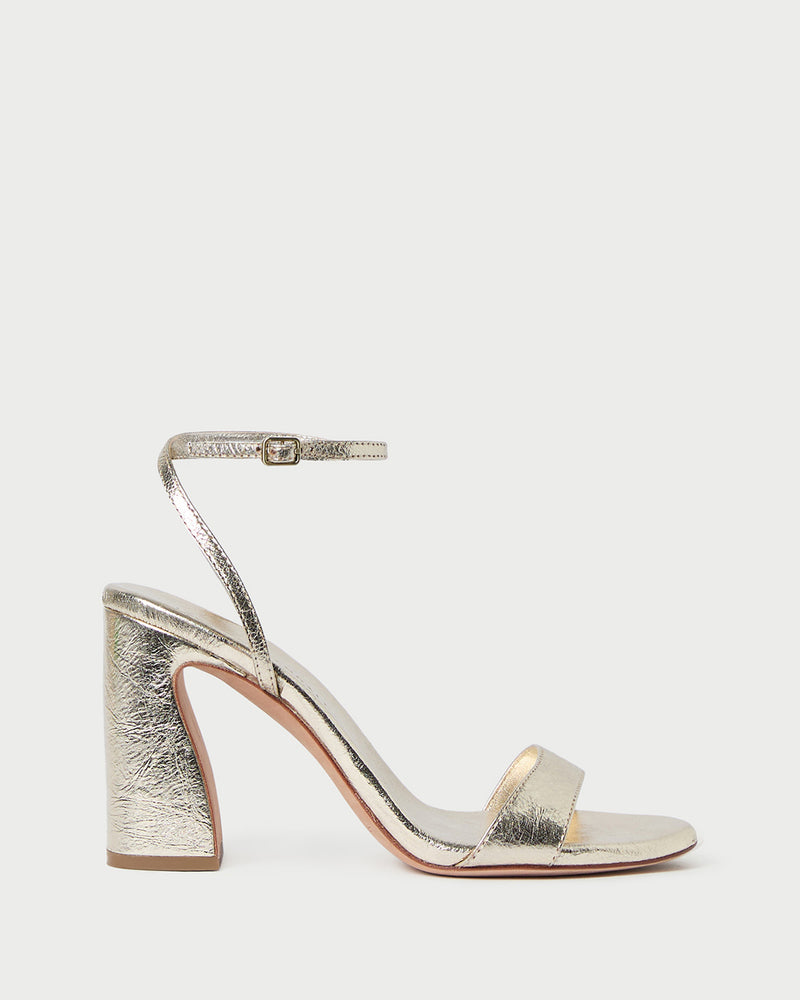 Malia Champagne Curved-Heel Sandal in metallic champagne leather
