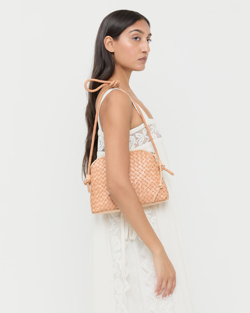 Mallory Desert Sand Woven Crossbody in desert sand tan woven leather and Poppy Lace Dress in white cotton.