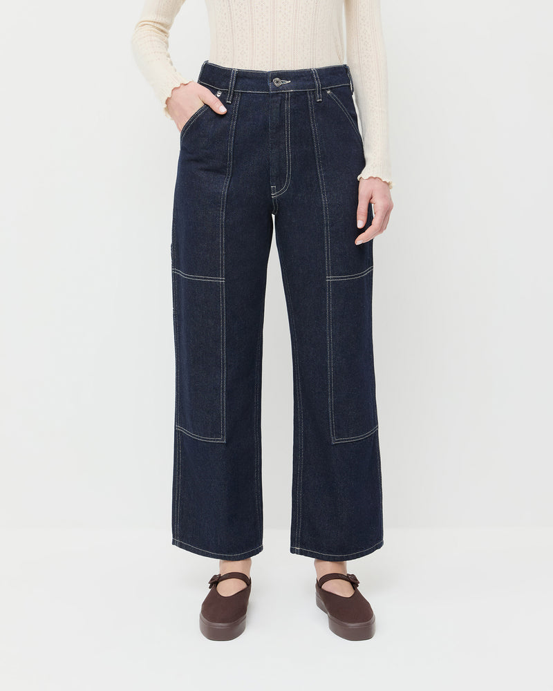 Molly Workwear Jean in dark blue denim, Lolo Pointelle Long-Sleeve Tee in cream cotton, and Cooper Dark Brown Mary Jane Sneaker.