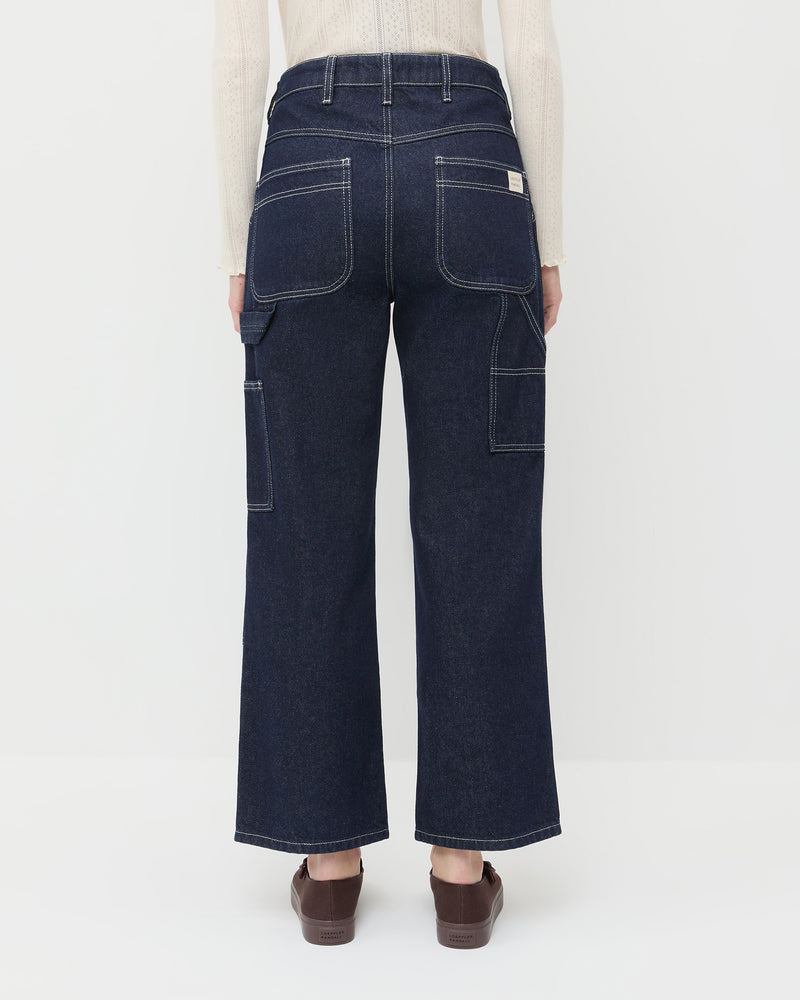 Molly Workwear Jean in dark blue denim, Lolo Pointelle Long-Sleeve Tee in cream cotton, and Cooper Dark Brown Mary Jane Sneaker.