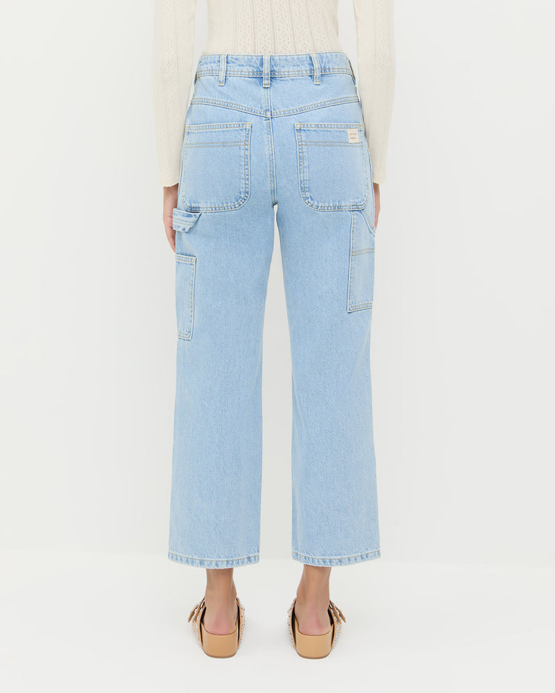 Molly Workwear Jean in light blue denim, Ash Pointelle Cardigan in cream cotton, and Joni Khaki Studded Sandal.