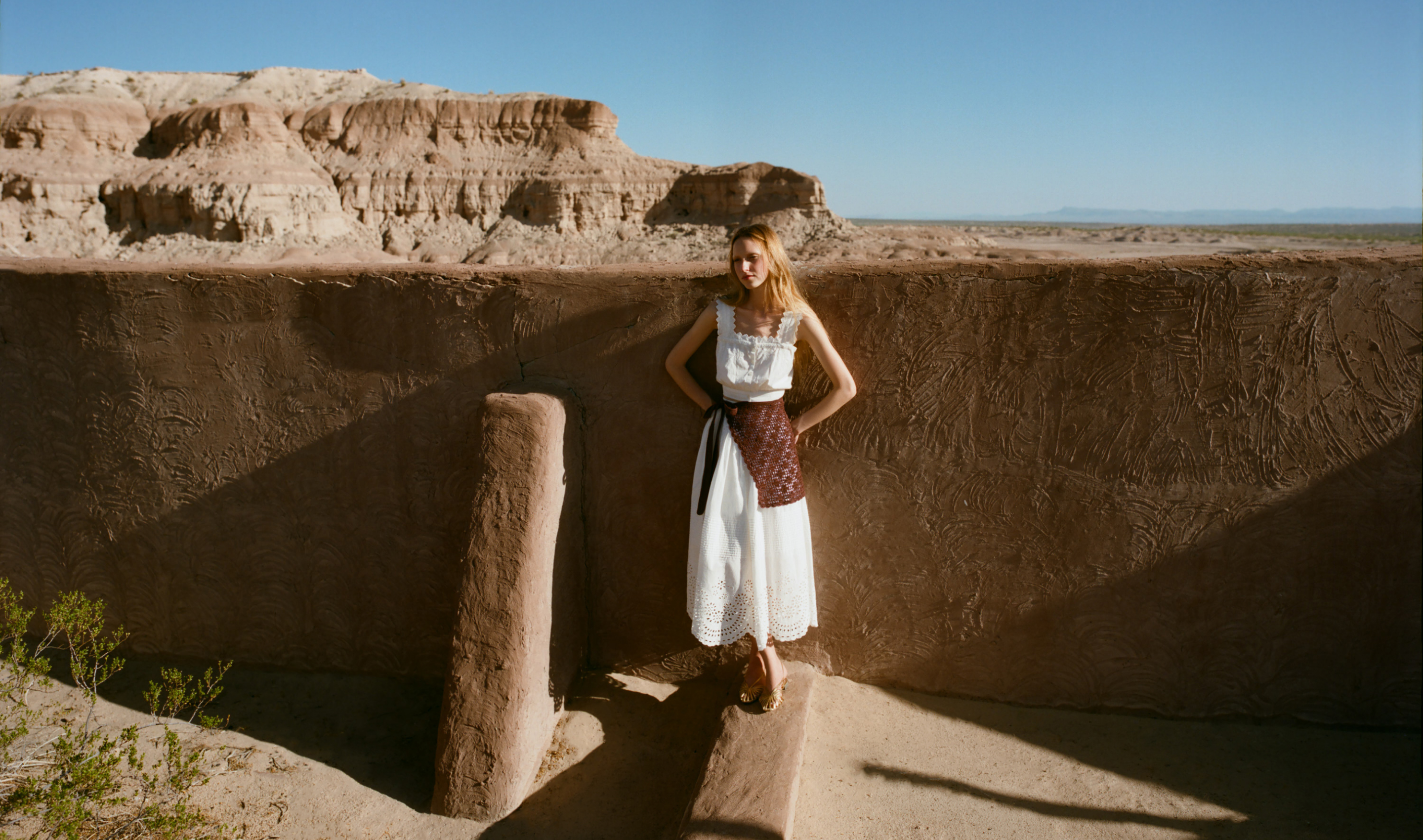 Runa Top in white cotton, Tinsley Skirt in white cotton, Betty Apron in brown crocheted cotton, and Devon Gold Slingback Sandall - Loeffler Randall