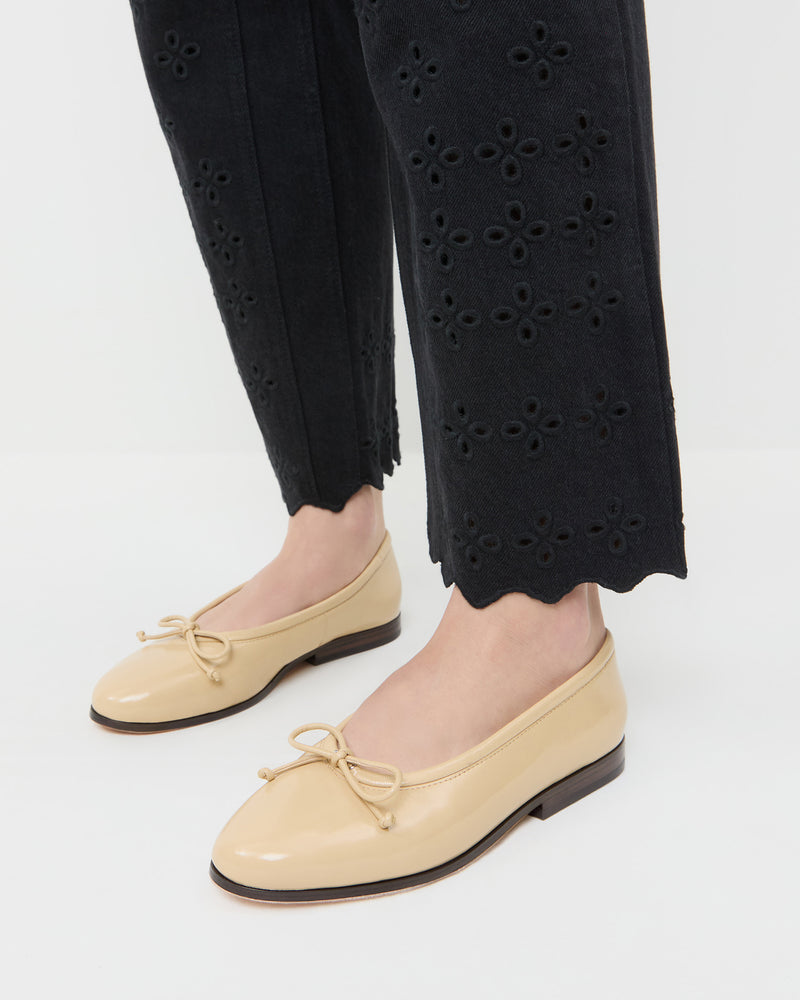 Noelle Bisque Ballet Flat in patent leather and Demi Embroidered Pant in black denim.