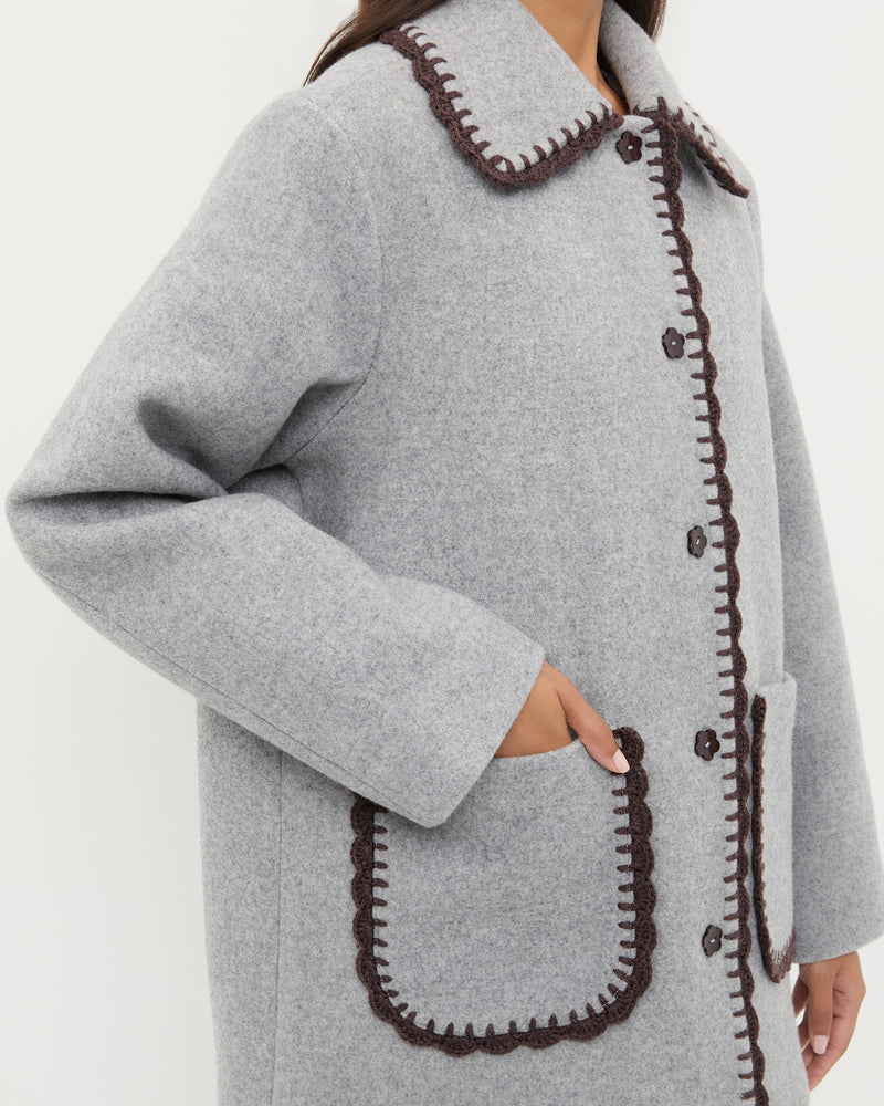 Patsy Wool Coat in grey wool with dark brown crochet trim.