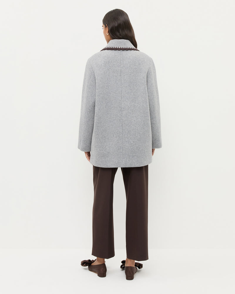 Patsy Wool Coat in grey wool with dark brown crochet trim.