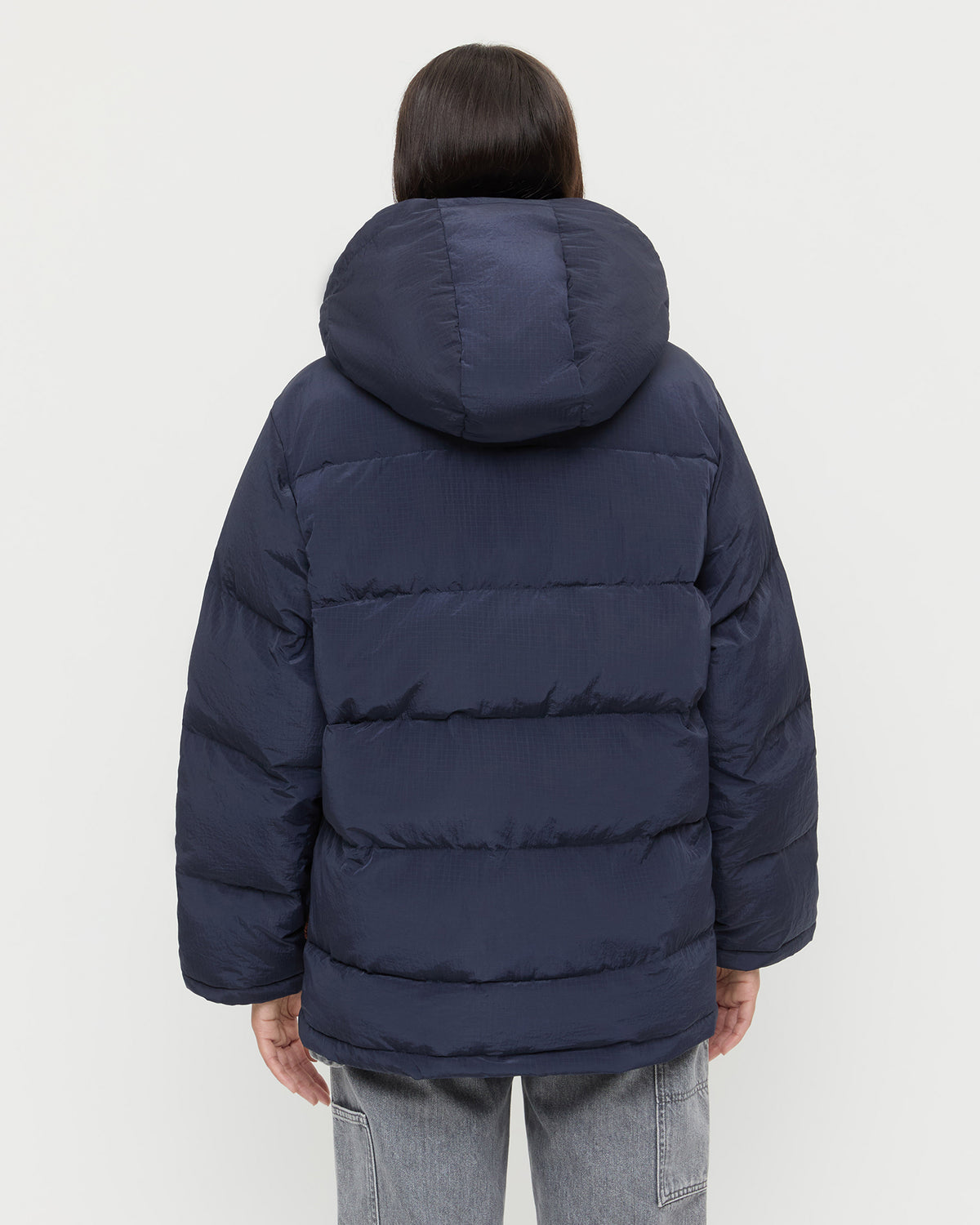 Pippa Puffer Coat in navy nylon and brown wool and Molly Workwear Jean in grey denim.