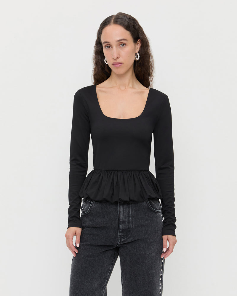 Posie Peplum Top in black jersey material and Winona Denim Barrel Pants in washed black with crystal accents.