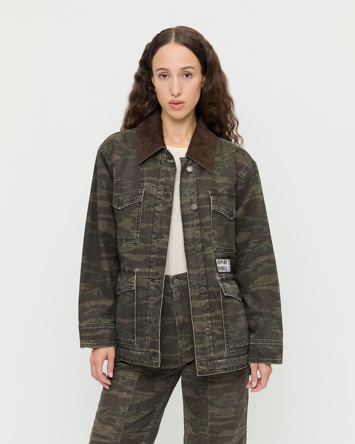 Quincy Jacket in dark camo denim, Molly Workwear Jean in dark camo denim, and Lolo Pointelle Long-Sleeve Top in cream pointelle.