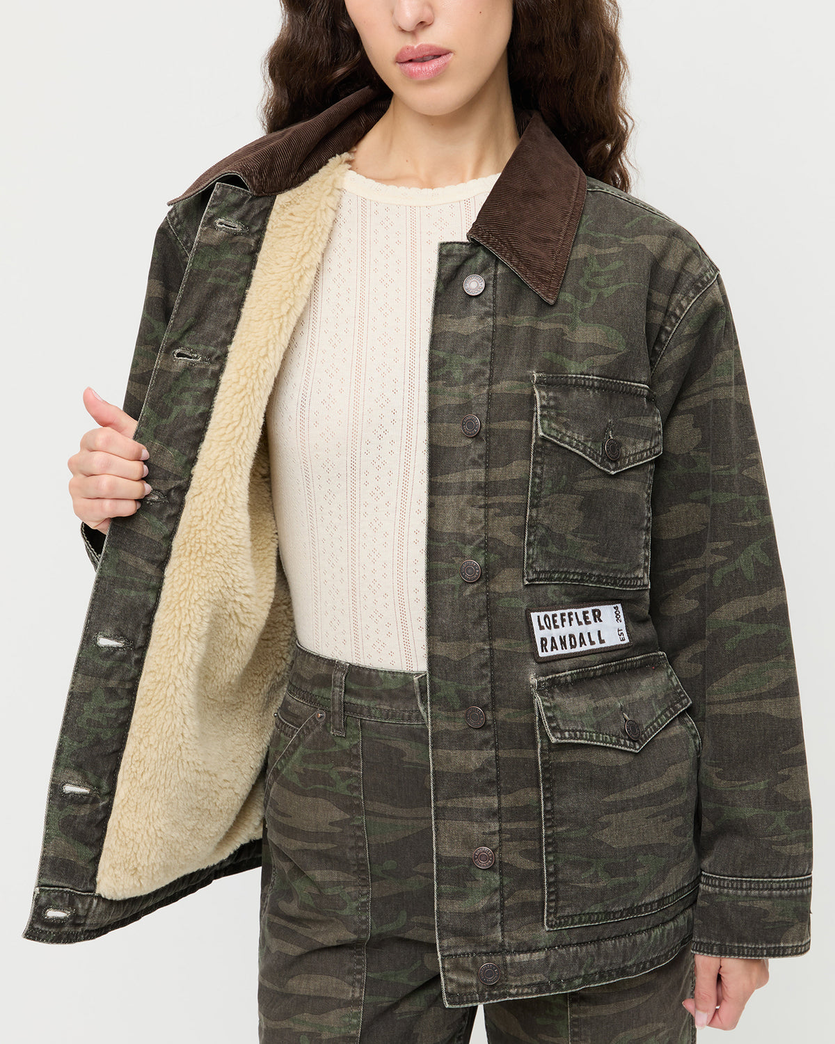 Quincy Jacket in dark camo denim, Molly Workwear Jean in dark camo denim, and Lolo Pointelle Long-Sleeve Top in cream pointelle.