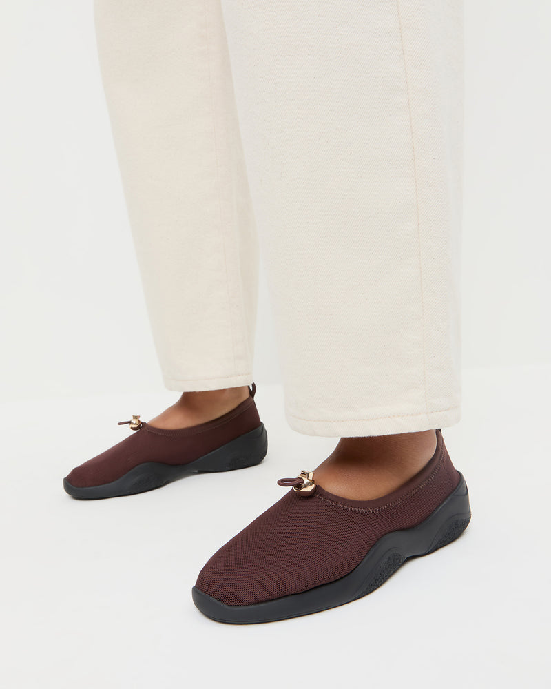 Raina Dark Brown Mesh Flat in dark brown mesh and Winona Denim Pant in natural denim.