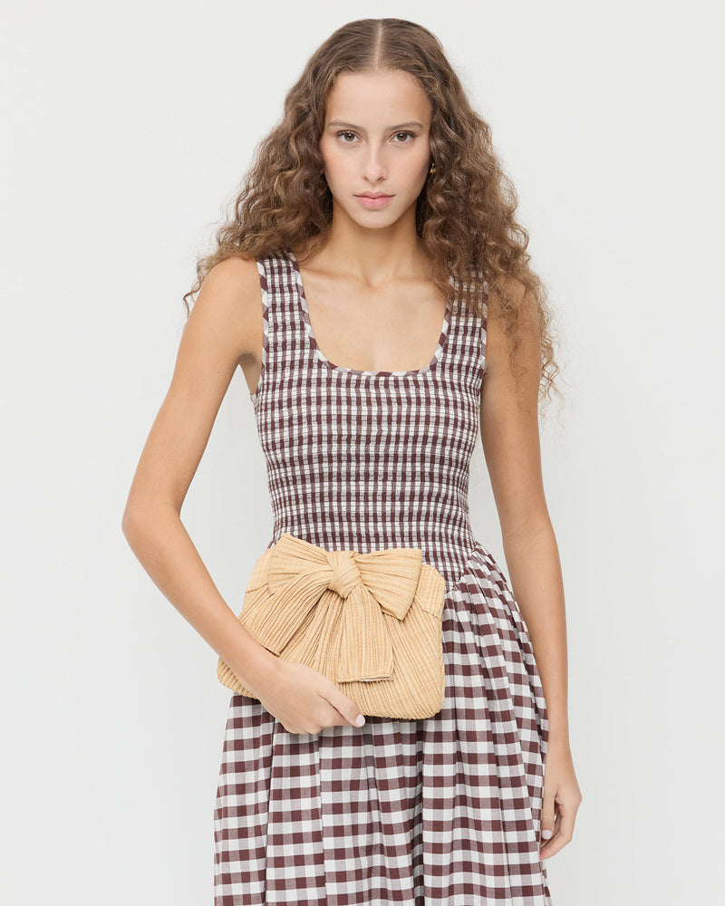 Rayne Natural Bow Clutch in pleated natural straw and Estelle Dress in brown gingham cotton.