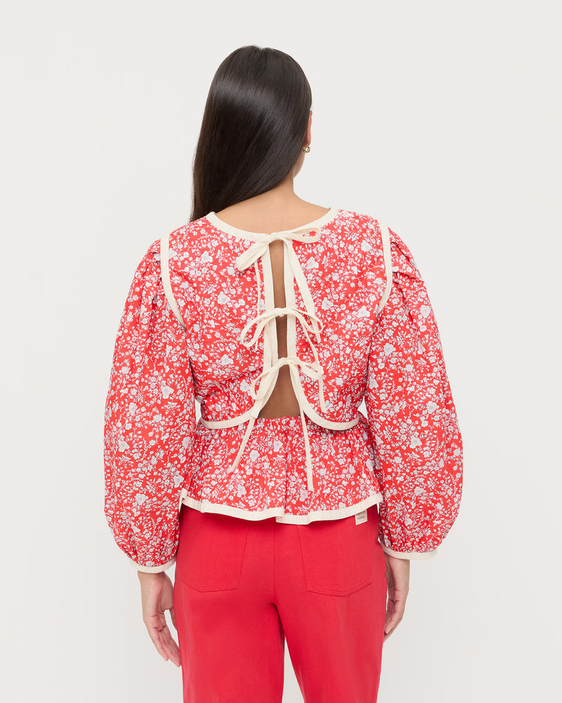 Rosa Top in red rosette floral cotton and Demi Embroidered Pant in red denim.