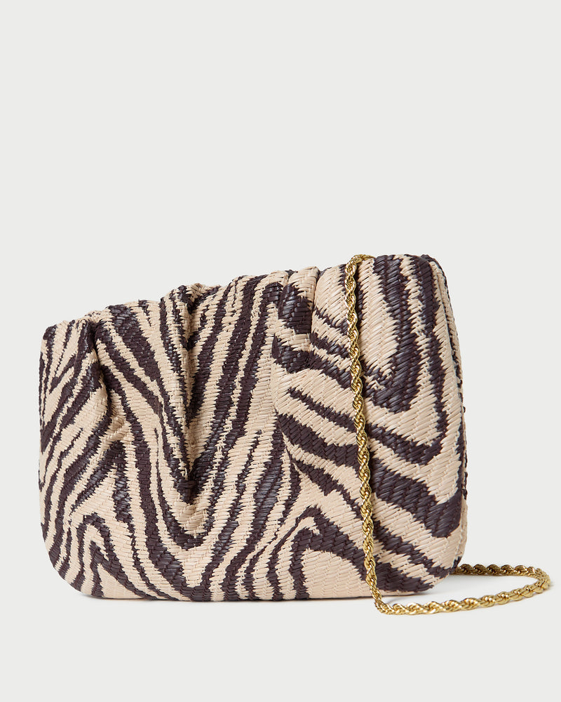 Serena Zebra Gathered Clutch in zebra print woven straw fabric.