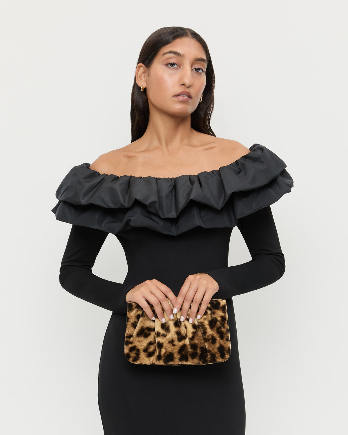 Serena Leopard Gathered Velvet Clutch in leopard print velvet and Suki Dress in black jersey fabric.