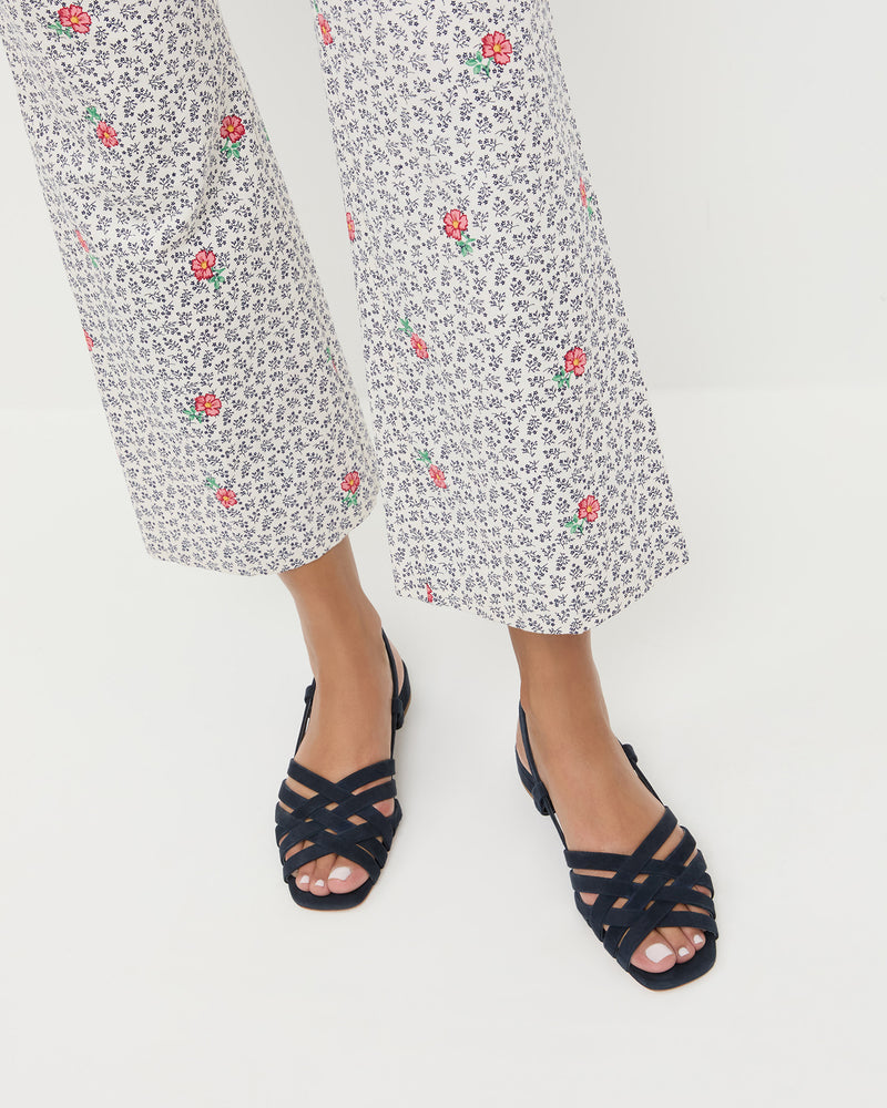 Shelly Navy Suede Flat Sandal in navy blue suede and Pasha Pant in blue floral cotton-linen.