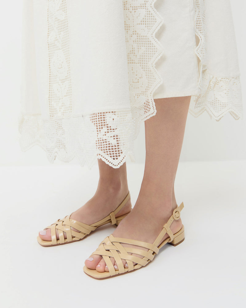 Shelly Bisque Leather Flat Sandal in bisque tan leather and Poppy Lace Dress in white cotton.