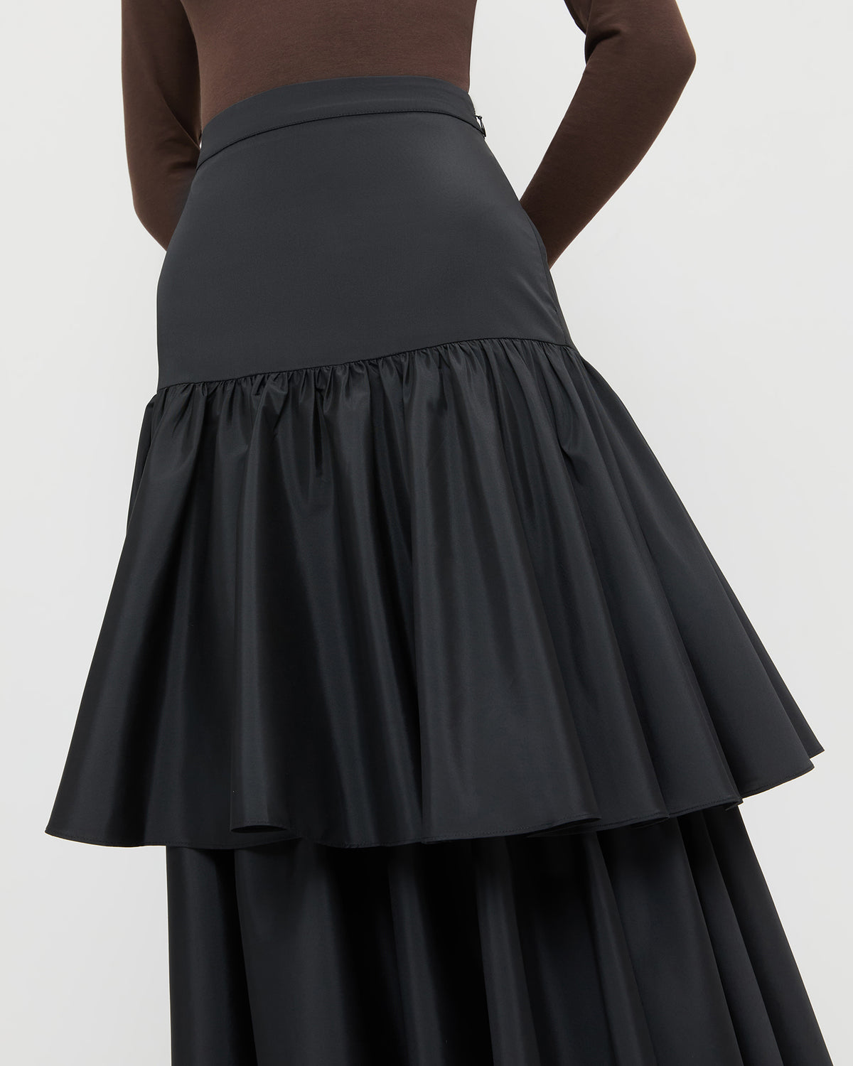Sora Skirt in black taffeta and Lumi Long Sleeve Bodysuit in chocolate brown jersey.