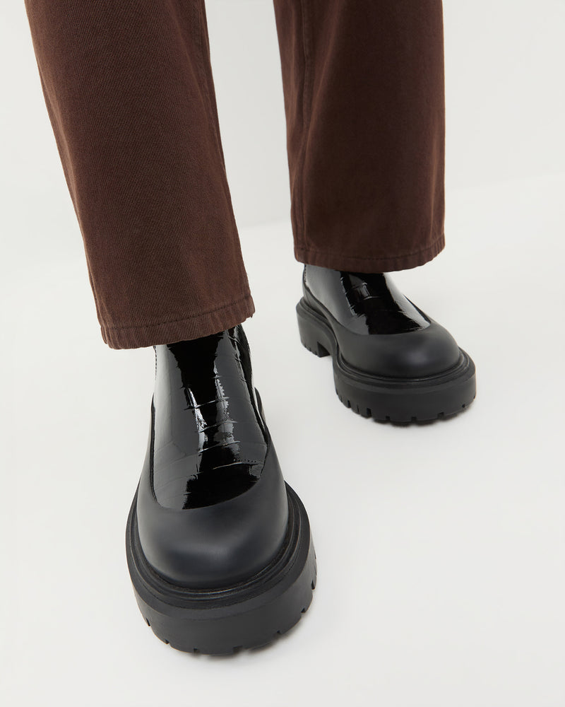 Suri Crocodile Leather Lug Boot in ebony crocodile-embossed leather.