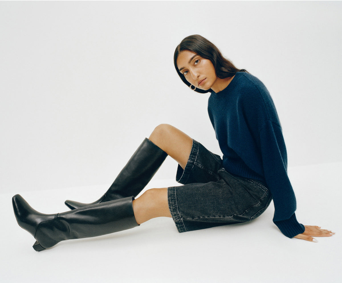 Lana Cashmere Sweater in navy cashmere, Everett Denim Short in washed black denim, and Indy Black Leather Tall Boot - Loeffler Randall