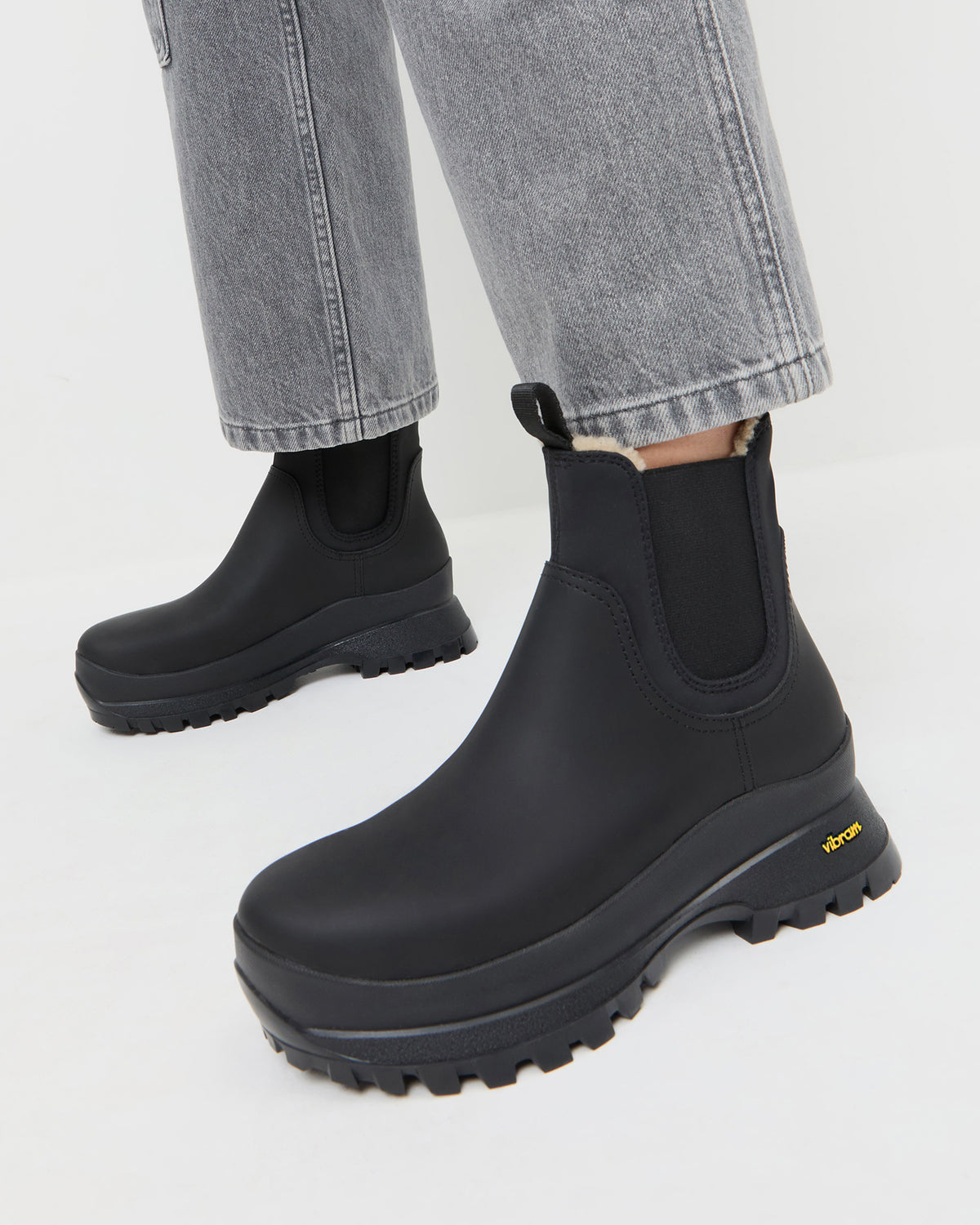 Tara Black Shearling-Lined Boot in black leather and Molly Workwear Jean in grey denim.