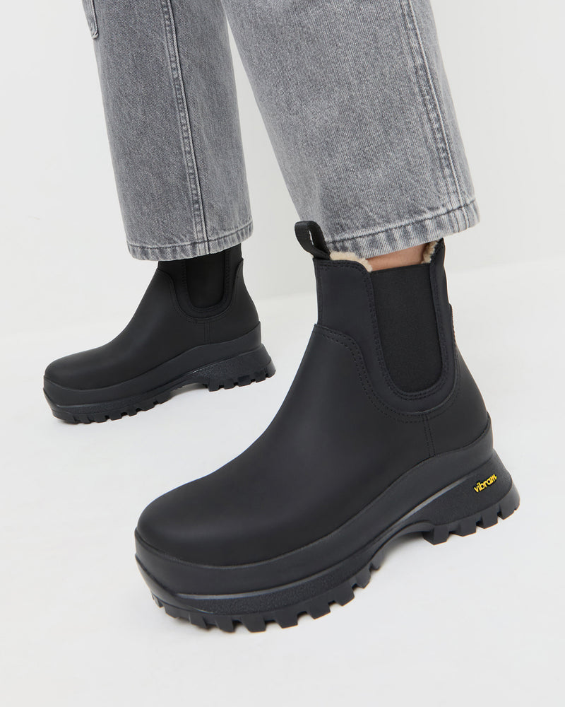 Tara Black Shearling-Lined Boot in black leather and Molly Workwear Jean in grey denim.