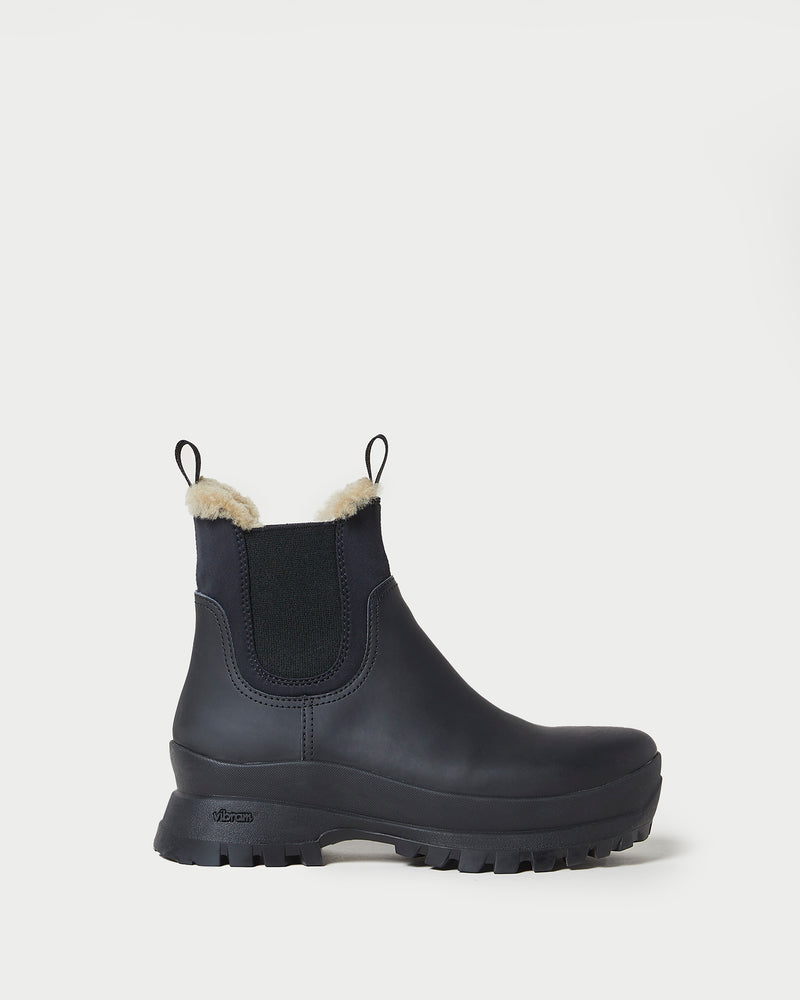 Tara Black Shearling-Lined Boot in black leather.