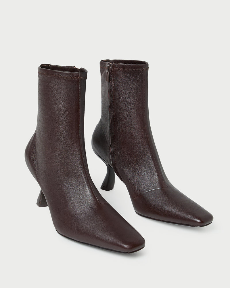 Thandy Brown Leather Curved Heel Bootie in brown leather.
