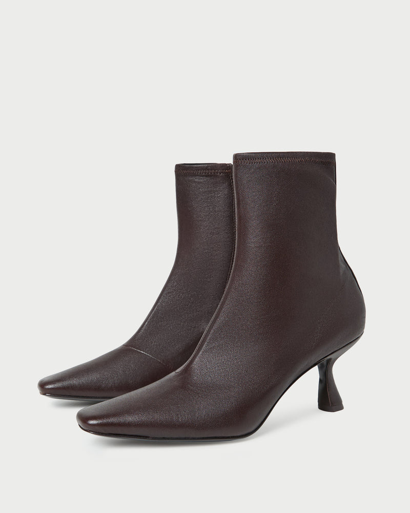 Thandy Brown Leather Curved Heel Bootie in brown leather.