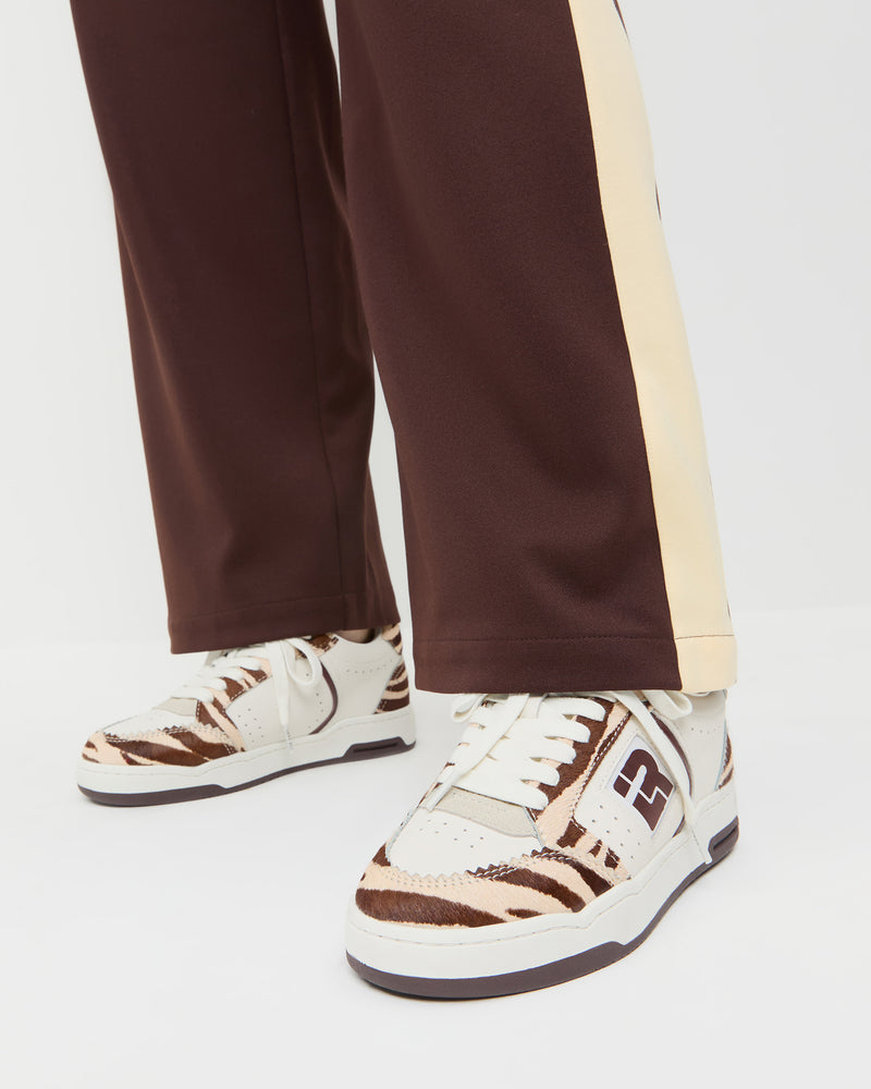 Topspin Cream/Zebra Court Sneaker in cream leather and Zebra hair calf and Spencer Sweatpant in brown and butter jersey.