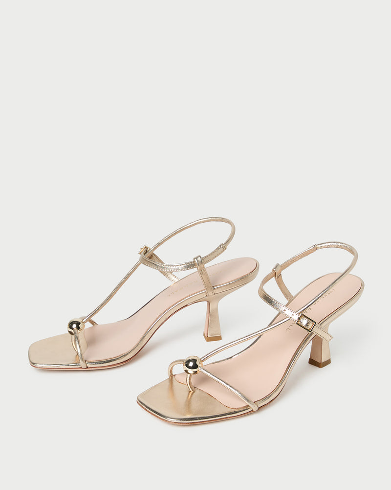 Triana Champagne Leather Mid-Heel Sandal in champagne leather.