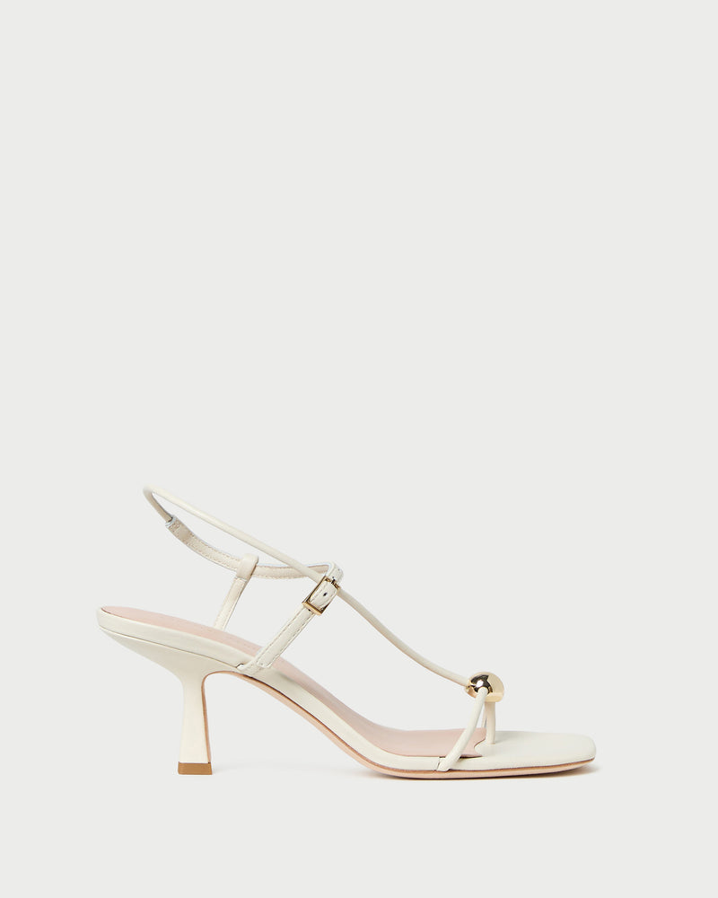 Triana White/Champagne Mid-Heel Sandal in white leather.
