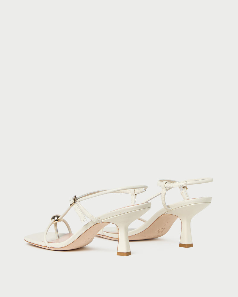 Triana White/Champagne Mid-Heel Sandal in white leather.
