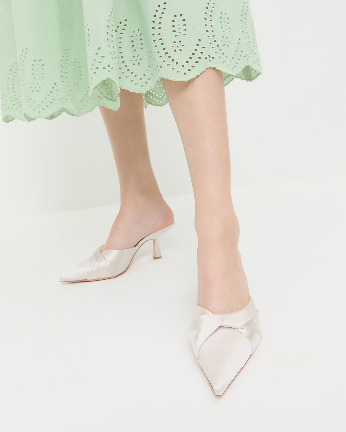 Tyla Cream Satin Twisted Mule in cream satin and Thelma Eyelet Dress in mint green cotton.