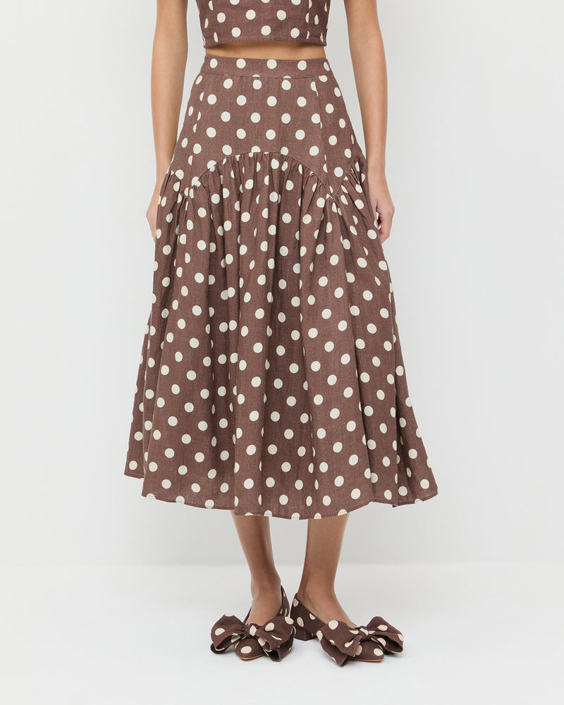 Valeria Skirt in brown/cream polka dot in linen, Vega Top in brown/cream polka dot in linen, and Noa Brown/Cream Linen Bow Flat.