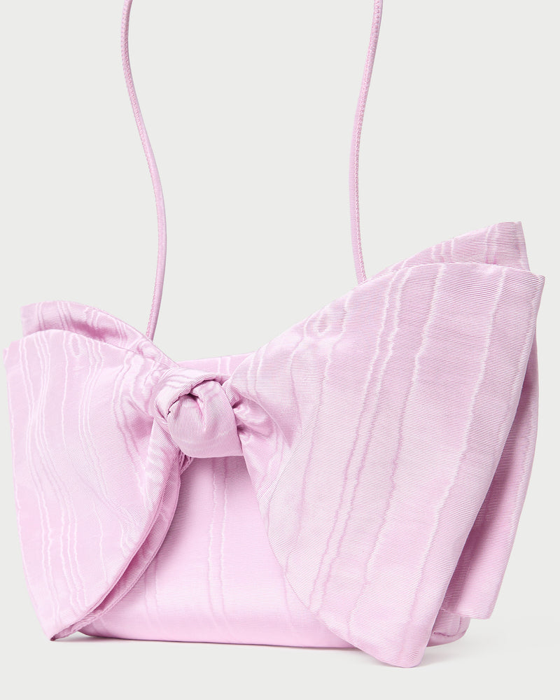 Valerie Pink Moiré Bow Clutch in powder pink.