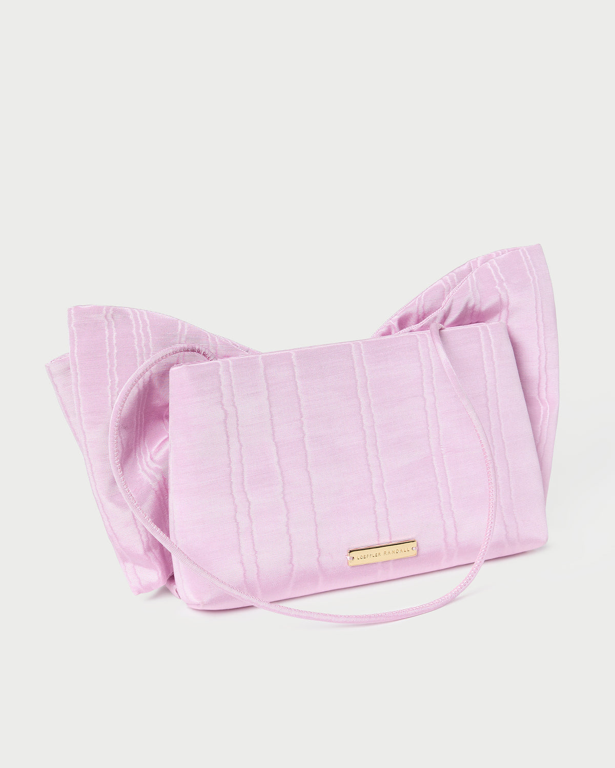 Valerie Pink Moiré Bow Clutch in powder pink.