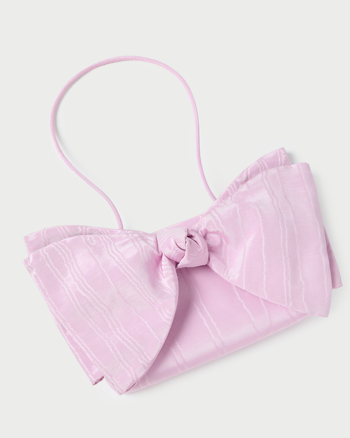 Valerie Pink Moiré Bow Clutch in powder pink.