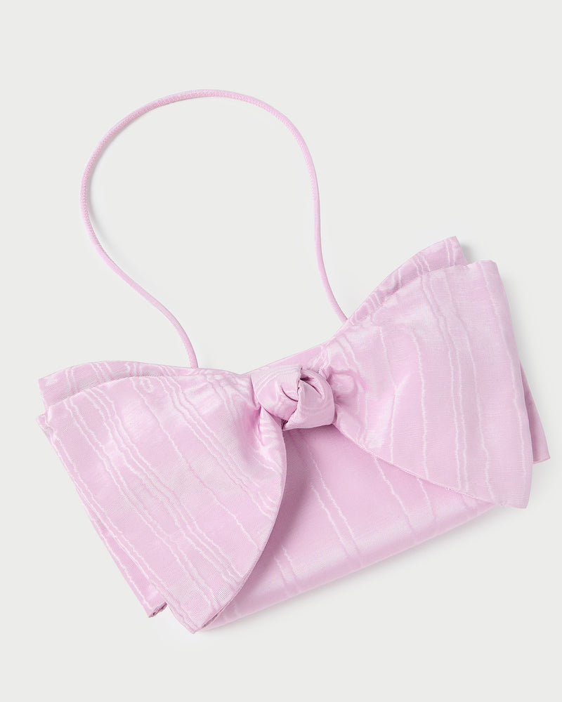 Valerie Pink Moiré Bow Clutch in powder pink.