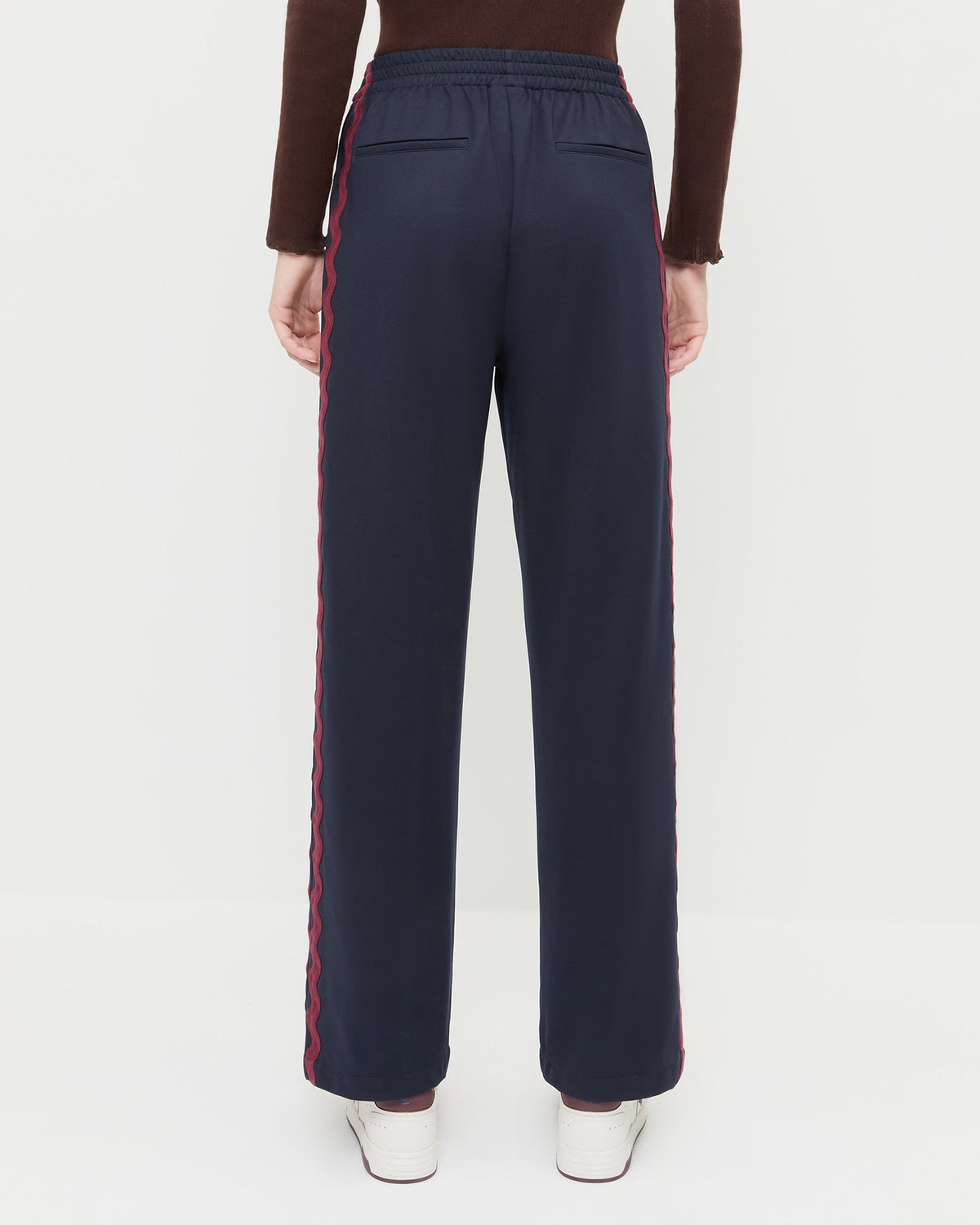 Venus Track Pant in navy nylon, Lolo Pointelle Long-Sleeve in espresso brown cotton, and Topspin Cream/Maroon Court Sneaker.