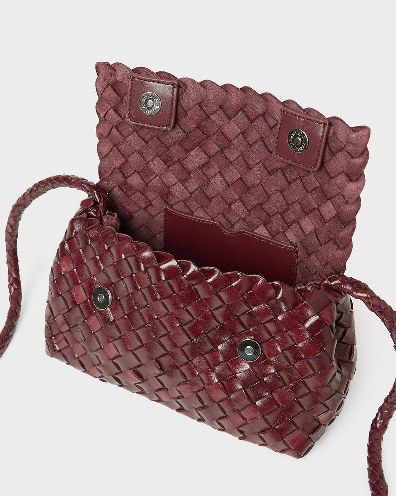Vinnie Maroon Woven Leather Crossbody in maroon woven leather.